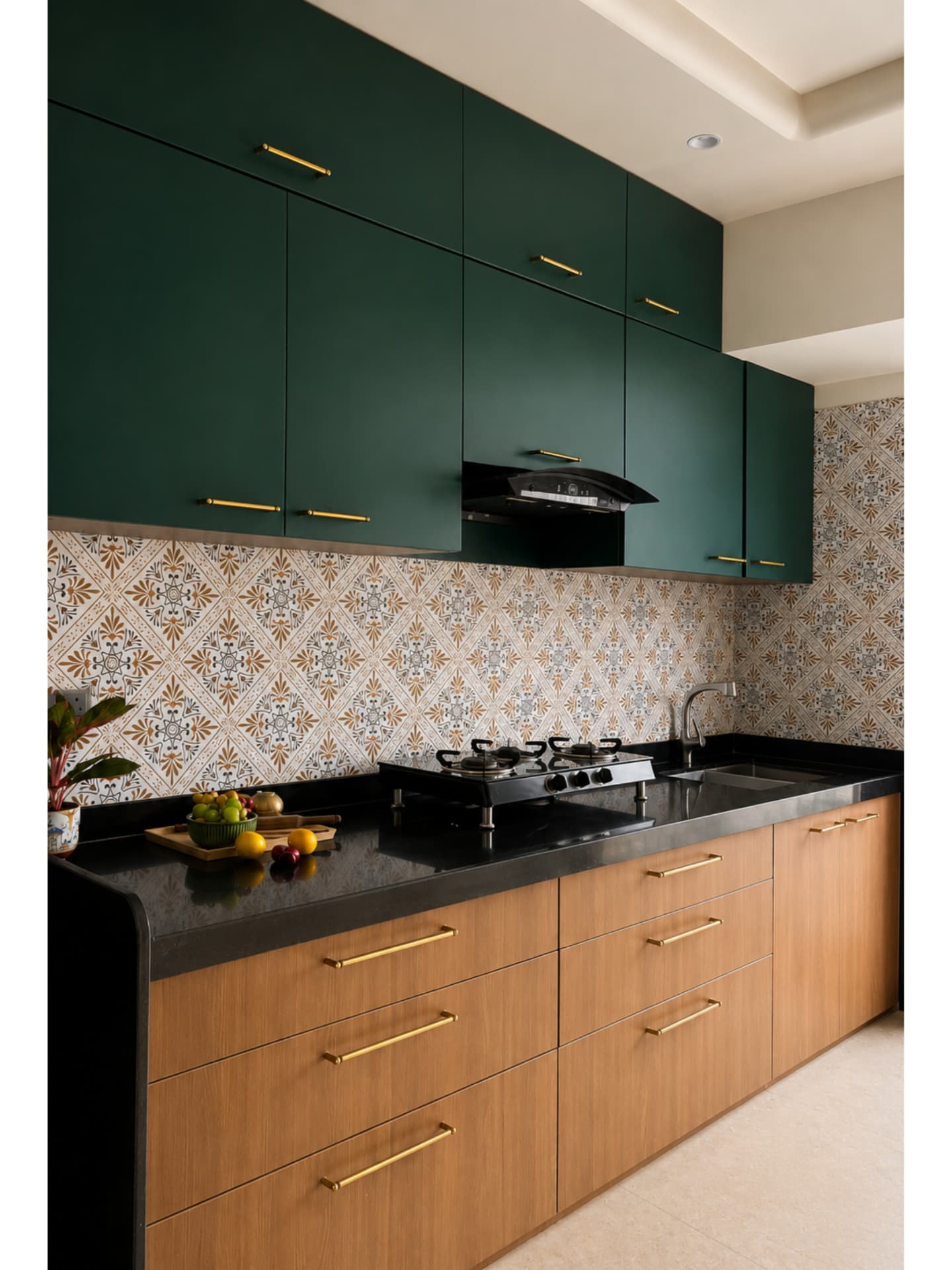 Kitchen in forest green and oak with patterned tile backsplash and brass handles